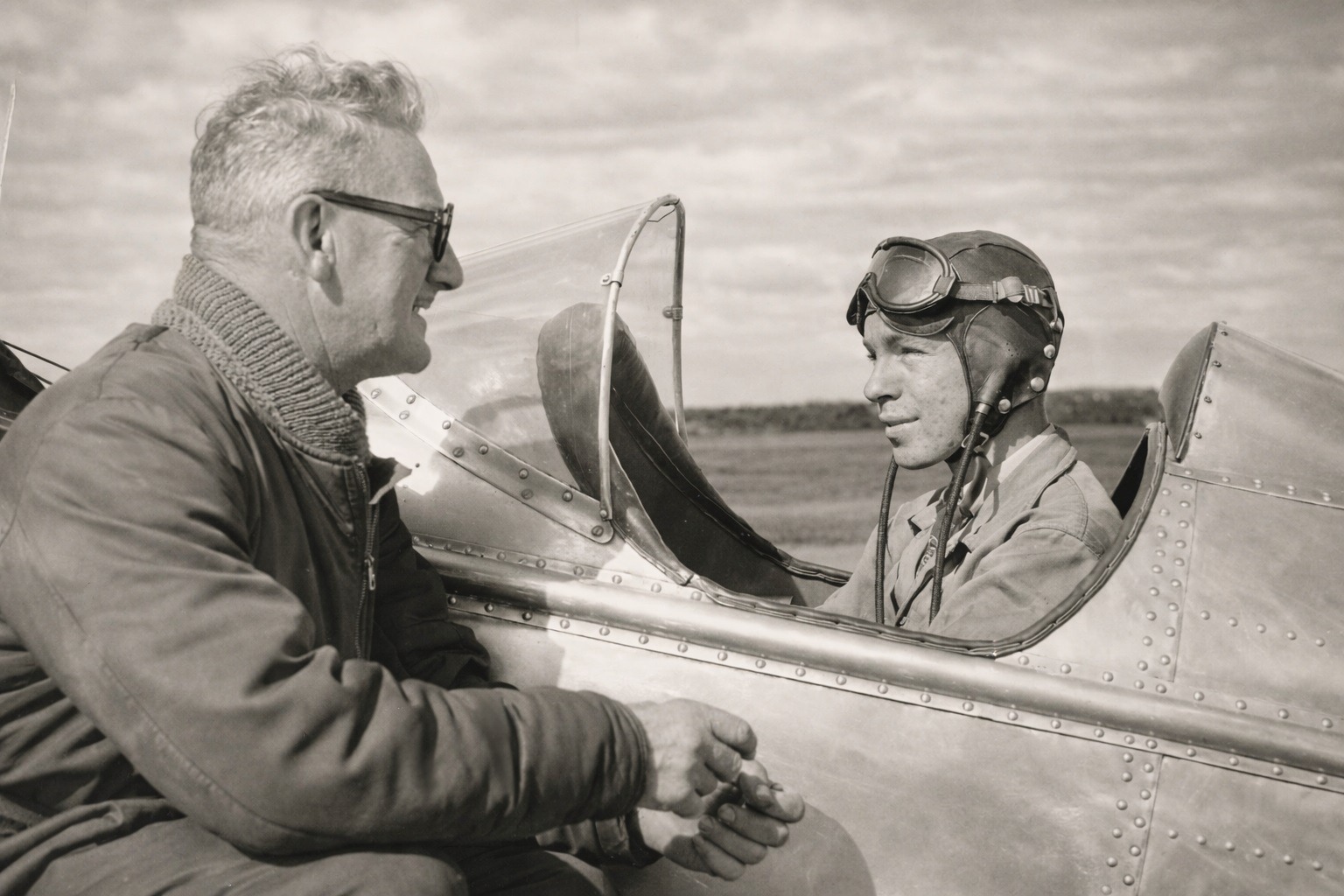 H.K. Morris and Howard R. Morris beside a training aircraft